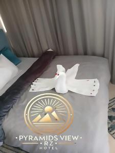 Krevet ili kreveti u jedinici u objektu Pyramids View R Z Hotel