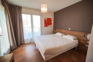 Postel nebo postele na pokoji v ubytování Residence Les Chataigniers