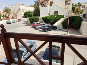 a balcony with cars parked in a parking lot at jo sunny lakes in Sharm El Sheikh