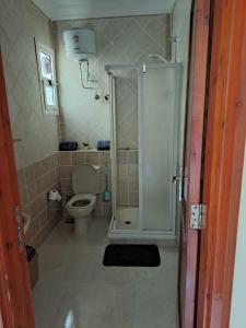 a bathroom with a shower and a toilet at jo sunny lakes in Sharm El Sheikh
