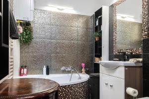 Koupelna v ubytování Millenaris Apartment + 21 fotografií