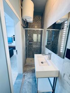 a bathroom with a sink and a shower at Sliema Penthouse 3 Ensuite Bedrooms Seaview - Zero55 in Sliema +45 photos