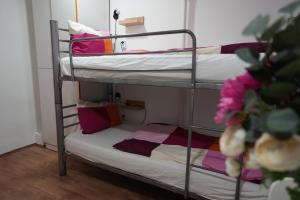 a couple of bunk beds in a room at Center Hostel and Guest House in Budapest