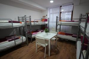 A bed or beds in a room at Center Hostel and Guest House