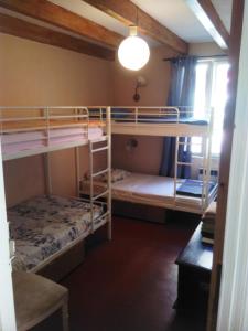 two bunk beds in a small room with a lamp at Crew Lighthouse in Antibes
