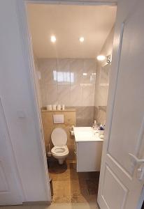 a bathroom with a toilet and a sink at Crew Lighthouse in Antibes
