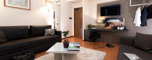 a living room with a couch and a table at Da Porto Vicenza Apartments in Vicenza