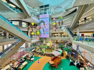 an overhead view of a shopping mall with people at i-City Shah Alam Residences by ASDEH Suites in Shah Alam