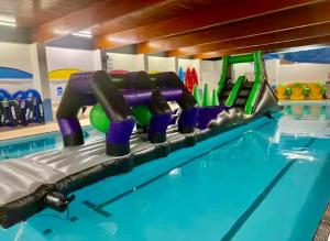 a swimming pool with a swimming pool at Ocean Pearl Home in Heysham