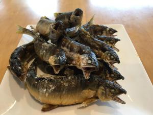 a pile of fish on a plate on a table at おれっちのひみつきち3 in Shimada