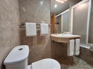 a bathroom with a toilet and a sink at Porto River Sunset 1st in Vila Nova de Gaia +25 photos