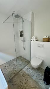 a bathroom with a shower and a toilet at Heaven Homes - Traumhafter Ausblick am Wald in Bad Driburg +12 photos