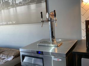 a machine sitting on top of a microwave at B&B Sitari County Estate - The Most Iconic Estate in Cape Town