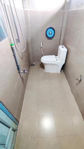 a small bathroom with a toilet in a room at Natural Garden BMT in Buon Ma Thuot