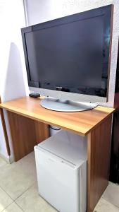 Televízia a/alebo spoločenská miestnosť v ubytovaní Hostal La Rosa