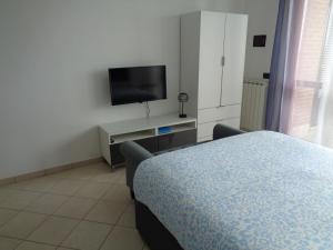 TV a/nebo společenská místnost v ubytování Locazione Turistica Gloria