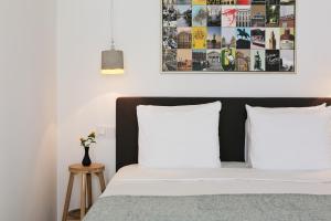 a bedroom with a bed with two white pillows at Bacán bed&business in The Hague