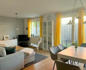 a living room with a couch and a table at Meeresrauschen 03 in Neuhaus