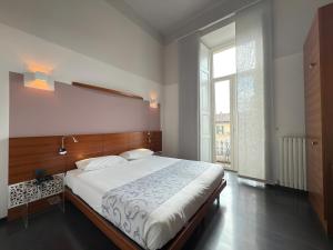 Postel nebo postele na pokoji v ubytování Hotel Europa Varese