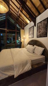 a bedroom with a large bed in a room at Villa Neka in Luk +17 photos