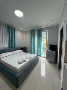 Postel nebo postele na pokoji v ubytování Hotel Erta
