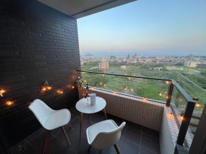 Balkón nebo terasa v ubytování 漫遊文旅溫泉宅一山海景觀陽台房一晚上7點入住一晚進晚退-21小時睡飽飽方案