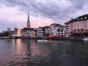 a group of people in a boat on a river at Top duplex Apartment Zurich-Limmattal in Killwangen