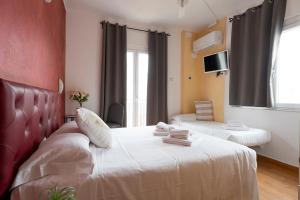 Ένα ή περισσότερα κρεβάτια σε δωμάτιο στο Hotel Le Vele