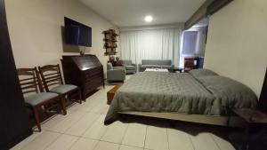 En eller flere senge i et værelse på DEVOTO Studio Center