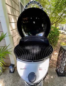 a black and white toilet sitting outside of a house at Cozy Family Home Downtown-KingBed-Free Parking-Central in Atlanta