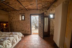 Albergo Diffuso - Rocca Calascioにあるベッド