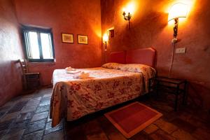 Albergo Diffuso - Rocca Calascioにあるベッド