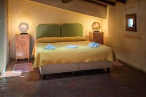 Postel nebo postele na pokoji v ubytování Albergo Diffuso - Rocca Calascio