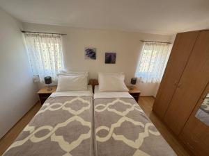 Postel nebo postele na pokoji v ubytování Apartment Pirun