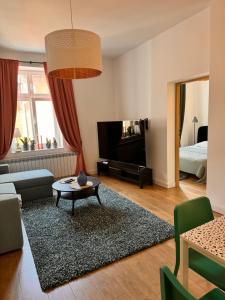 a living room with a couch and a table at Apartament Tuchola in Tuchola