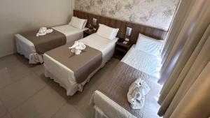 Postel nebo postele na pokoji v ubytování Pietro Angelo Hotel