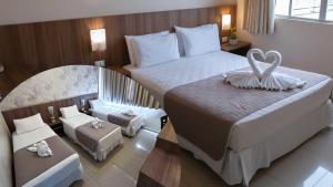 Postel nebo postele na pokoji v ubytování Pietro Angelo Hotel