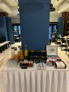 a table with drinks and pastries on it at Hotel Terminus Lyon in Paris