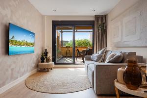 a living room with a couch and a view of the ocean at Casa Gabriel La Cala de Mijas in La Cala de Mijas