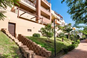 a building with stone steps in front of a building at Casa Gabriel La Cala de Mijas in La Cala de Mijas