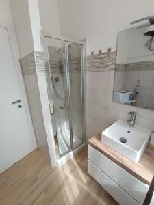 a bathroom with a shower and a sink at Casa Vacanze Martina in Piombino