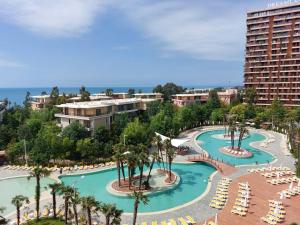 an aerial view of a pool at a resort at Luxury Oasis Apartment in Chakvi