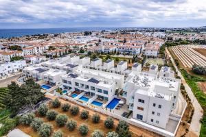an aerial view of a city with white buildings at Anchora in Paralimni