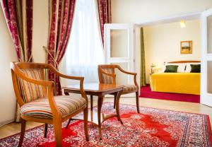 Postel nebo postele na pokoji v ubytování Boutique Hotel Seven Days