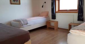 Postel nebo postele na pokoji v ubytování Guesthouse Myrkholt II
