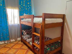 Postel nebo postele na pokoji v ubytování Panyumba Backpackers
