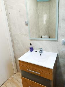 a bathroom with a sink and a mirror at Mesana playa in Cartagena +5 photos