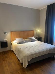 Postel nebo postele na pokoji v ubytování Condhotel Fanti