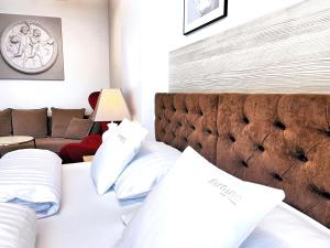 a hotel room with a bed and a couch at Fortune boutique old town in Poznań
