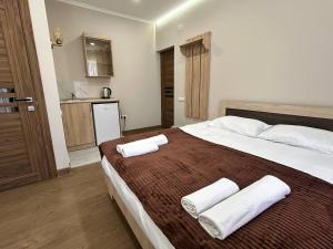 Postel nebo postele na pokoji v ubytování Guest House MARGARYAN